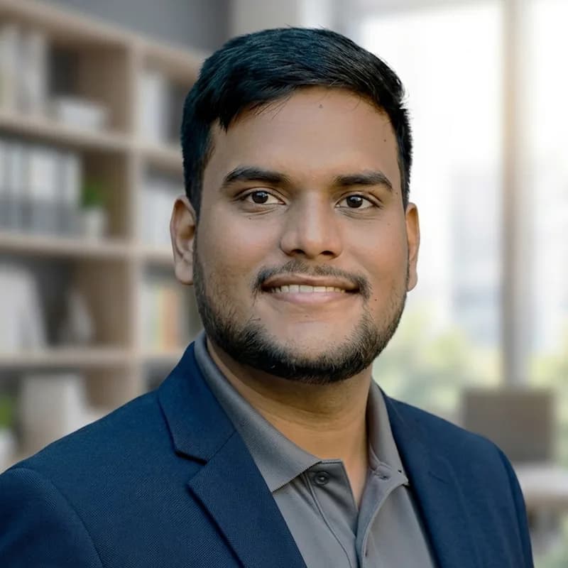 Rahul Mourya, full stack engineer, smiling in a navy blazer